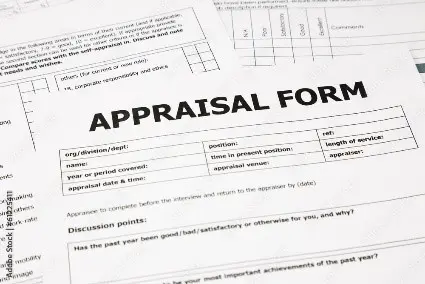 A close up of an appraisal form on top of papers