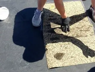 A person standing on the ground with their shadow cast.