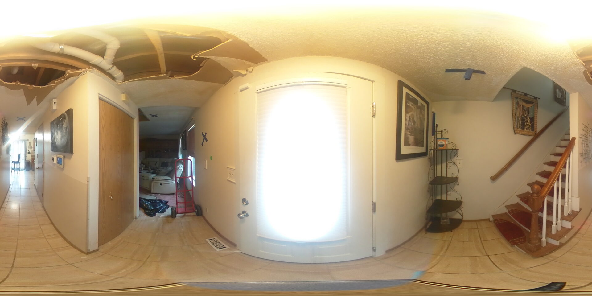 A fisheye view of the doorway to a room.